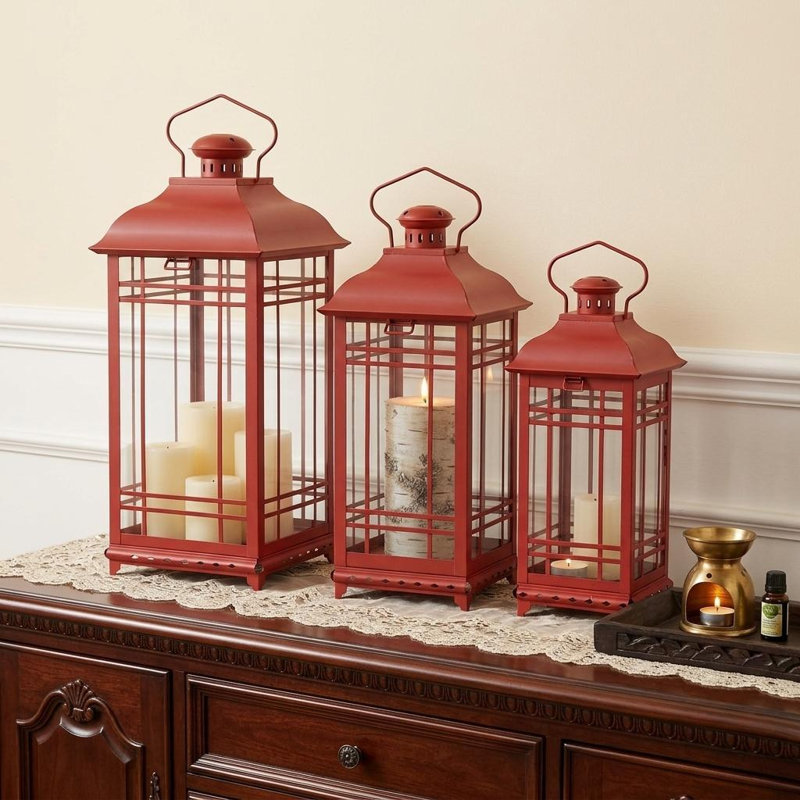 Ensemble de trois bougeoirs de lanterne de sol en métal et verre rouge