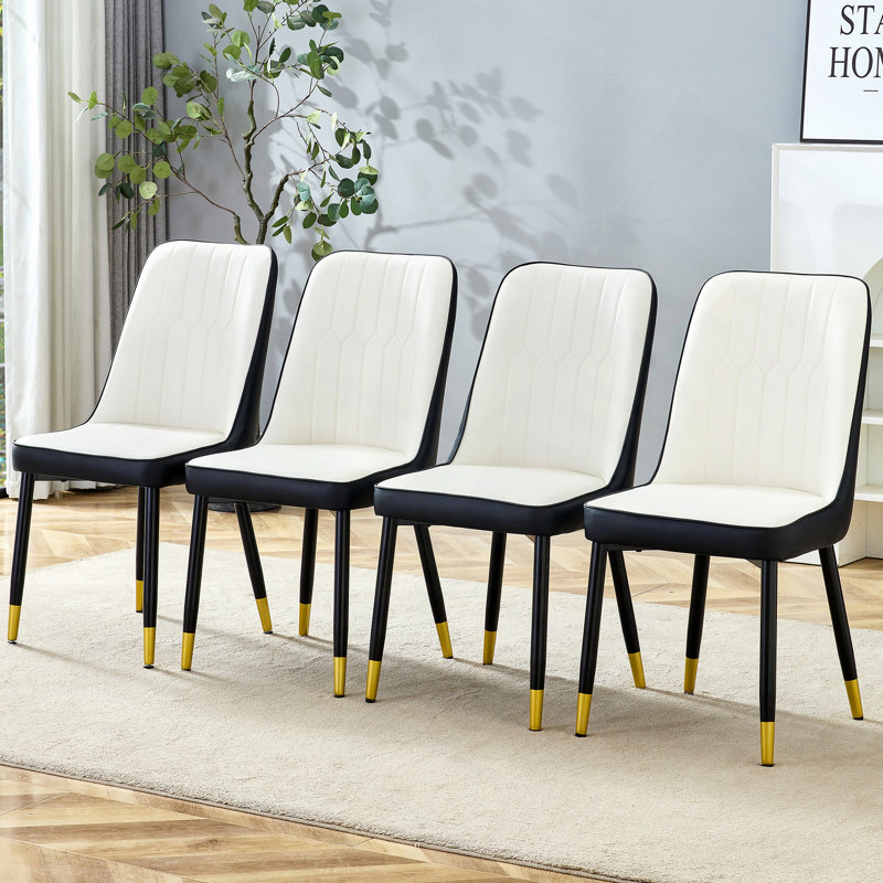 Chaises de salle à manger en polyuréthane bicolore, chaises avec pieds décorés en or. Pieds en métal noir et noir épissé, ensemble de 4 chaises.