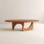 Table basse moderne en noyer moderne avec base sculpturale en arche