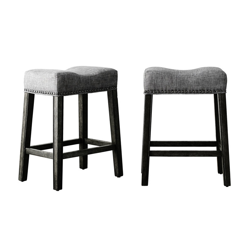 24" Gray Upholstered Backless Saddle Seat Counter Stools   Of 2 . Crafted From Real Wood With Weathered Appearance. Grey Upholstery. Contemporary Design. 18"W X 13"D 25"H. For Residential Use.