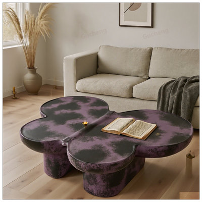 Table basse moderne en faux travertin texturé en forme de papillon pour le salon et le bureau, design élégant et durable
