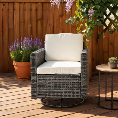 Fauteuil à bascule pivotant rond gris ardoise avec rotin en PE et coussins pour une utilisation à l'extérieur sur la terrasse
