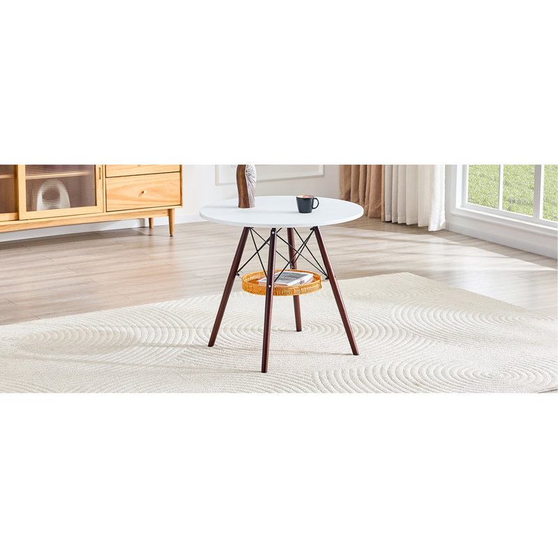 Table de salle à manger circulaire de 31,5 pouces de diamètre, plateau de table en panneau de fibres à densité moyenne blanc, pieds en bois massif de noyer, avec structure de panier de rangement suspendue. Une table basse décontractée pouvant accueillir de 2 à 4 personnes.