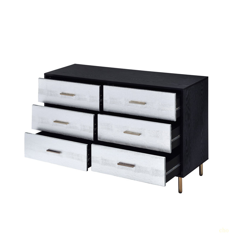 Commode noire, argentée et dorée
