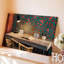 Toile Un espace de travail confortable avec un bureau en bois clair avec une chaise en rotin ornée d'un livre ouvert et une paire pour l'art mural moderne sur toile-1050617653