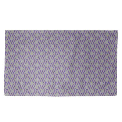 Tapis mauve à motif de zigzags