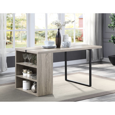 Table de salle à manger rectangulaire en chêne gris et noir, incrustations métalliques pour un style contemporain. Pieds offrant des options de rangement pratiques.