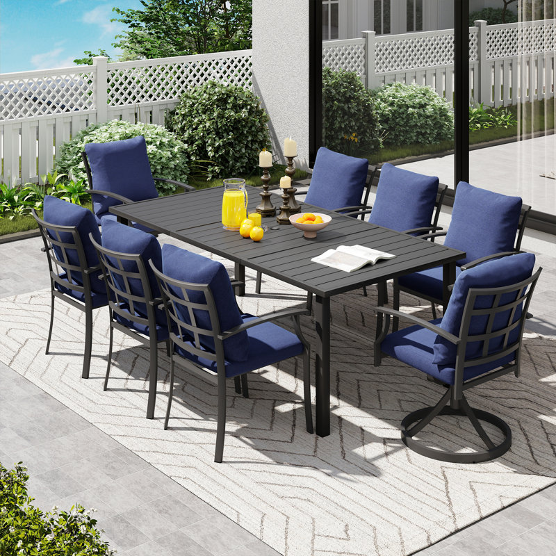 Ensemble de salle à manger en métal noir 9 pièces avec table rectangulaire, 2 chaises pivotantes et coussins bleus Maynard