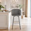 Tabouret de bar à hauteur fixe avec pivot en métal noir et velours gris avec repose-pieds carré en métal doré - ensemble de 2-2068089593