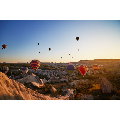 Hot Air Balloons Flying At Sunset by Millionsjoker - Wrapped Canvas Print