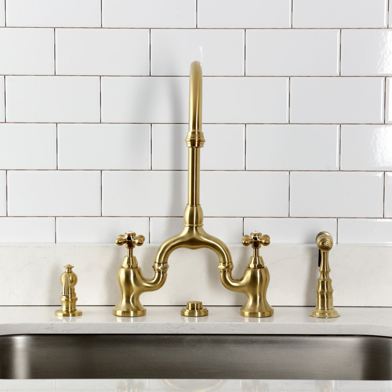 Kingston Brass English Country Two-Handle 3-Hole Deck Mount Bridge Kitchen Faucet with Side Sprayer, Brushed Brass