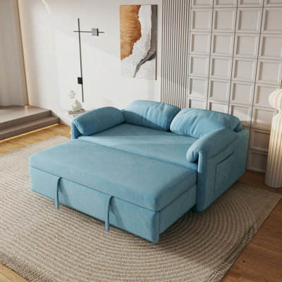 Présentation du canapé: canapé-lit en velours bleu - un bijou de salon à double usage avec option de lit escamotable
