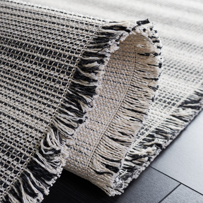 Ivory and Black Flat Woven 4' x 6' Synthetic Area Rug