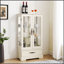 Armoire en verre blanc avec 2 portes, 1 tiroir, tablettes réglables et éclairage interne pour la présentation et le rangement-438379906