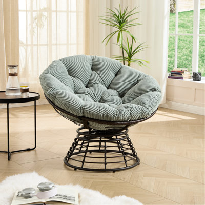 Fauteuil pivotant à 360° au design ergonomique, coussin épais et structure marron, idéal pour lire au salon. Rotation facile, parfaite pour la détente des adultes ou en extérieur.