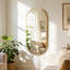 Miroir mural ovale en métal-669632245