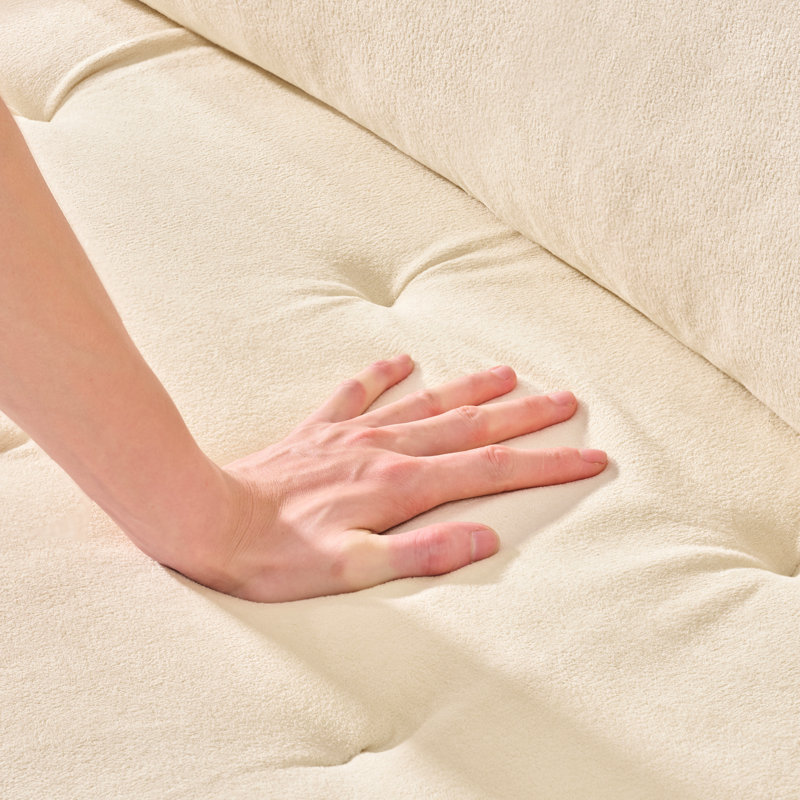Canapé confortable à assise profonde avec coussin moelleux, idéal pour divers espaces
