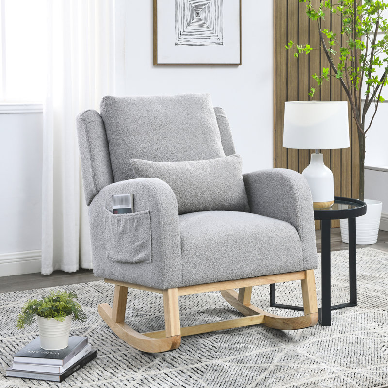 Fauteuil à bascule décontracté de couleur grise avec coussin lombaire extra confortable