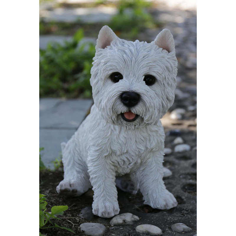 Statue terrier blanc assis