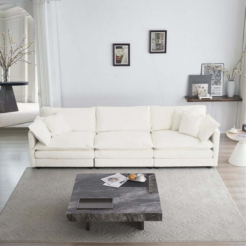Canapé 3 places polyvalent et élégant avec coussins d'accoudoirs et coussins décoratifs, parfait pour tout salon.