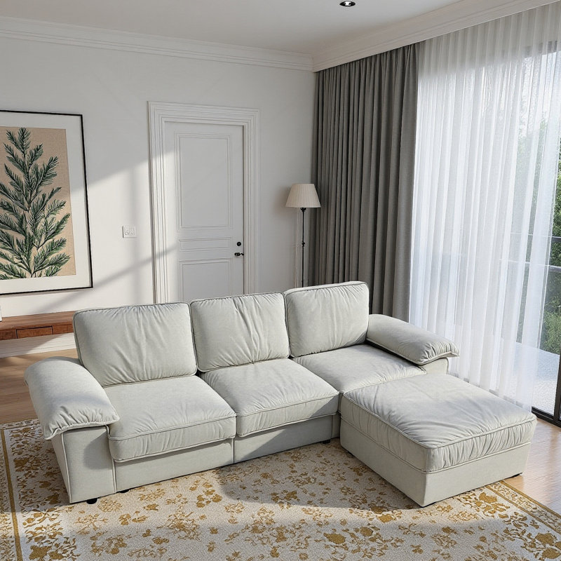Canapé modulaire moderne en L avec repose-pieds, rembourré en tissu doux, siège profond confortable, rangement dissimulé, idéal pour un appartement ou une maison