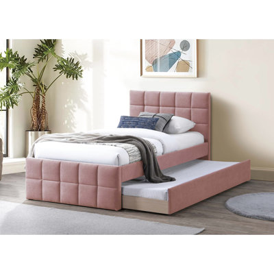Lit tapissier rose contemporain avec tête de lit à motif gigogne et grille pour une chambre à coucher
