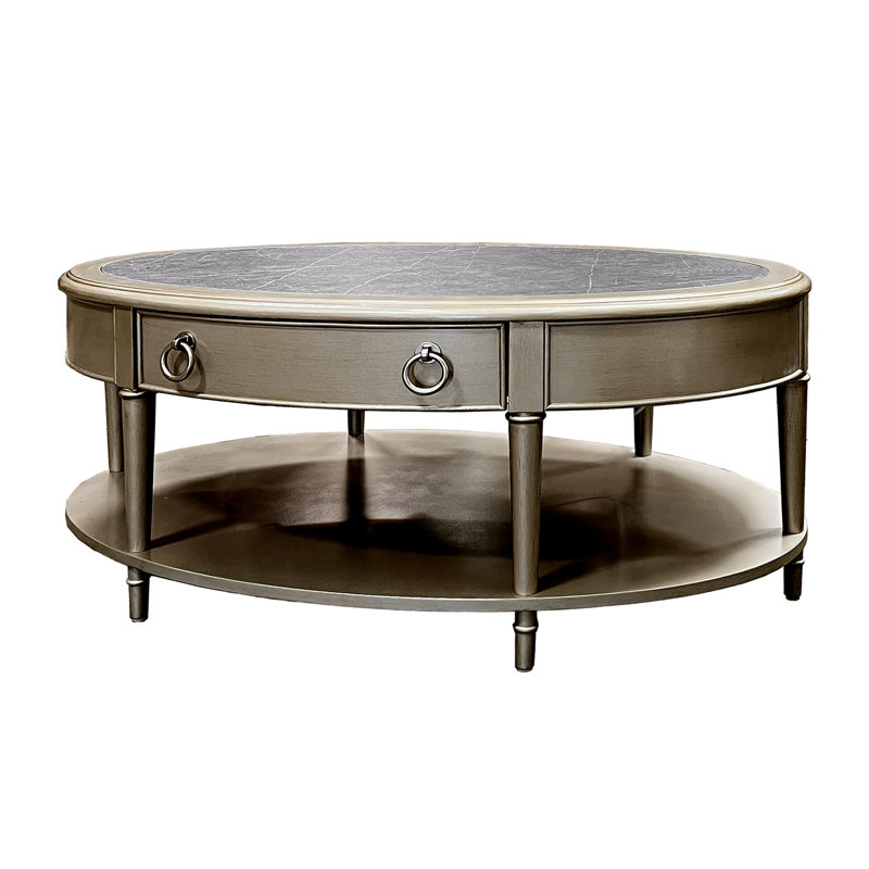 Table basse avec plateau en pierre frittée et finition champagne