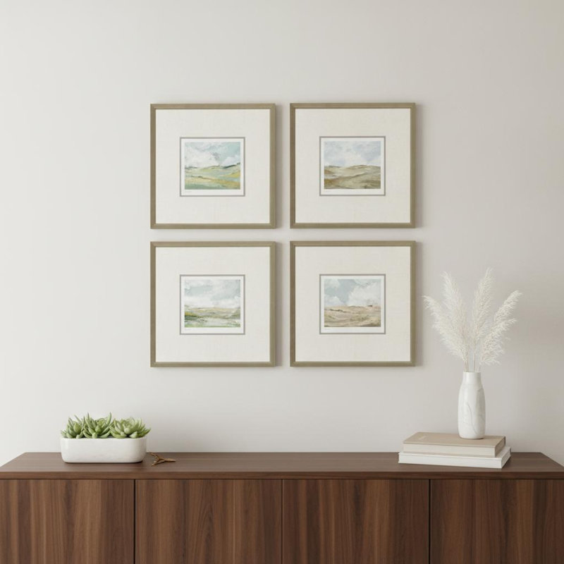 Ensemble de quatre impressions sur toile encadrées dorées