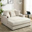 Chaise longue de 140 cm en chenille crème avec station de charge et porte-gobelets intégrés aux accoudoirs pour un confort optimal à l'intérieur. Housse amovible et lavable surdimensionnée pour se détendre à la maison.