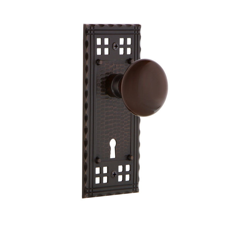 Assiette artisanale avec trou de serrure décoratif et bouton de porte en porcelaine brune, Bronze intemporel