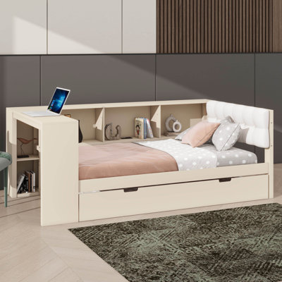 Lit plateforme en bois avec tablettes de rangement intégrées, lit gigogne escamotable, port de chargement USB et tête de lit tapissier