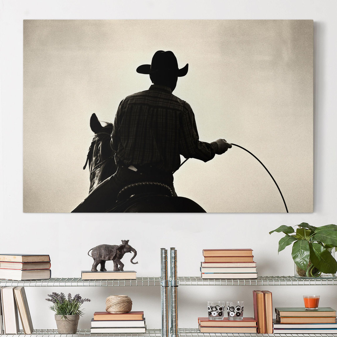 Leinwandbild Reitender Cowboy