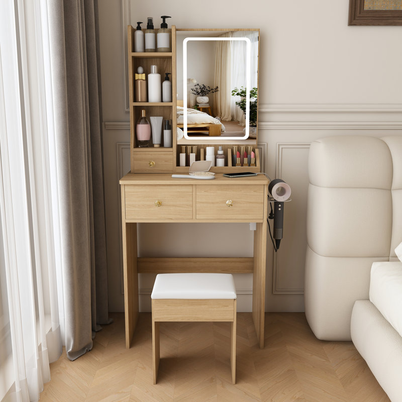 Coiffeuse moderne compacte, dotée de 3 modes d'éclairage DEL à luminosité réglable, de 3 tiroirs et de plusieurs étagères de rangement ouvertes, d'un support pour sèche-cheveux et d'une prise électrique.