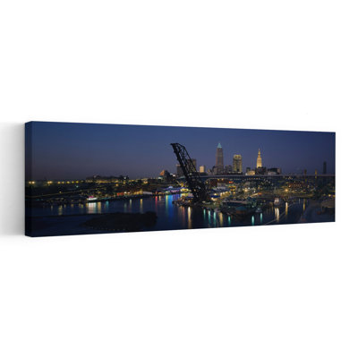 Skyscrapers lit up at night in a city Cleveland Ohio USA 1 Piece Wrapped Canvas Panoramic Wall Art