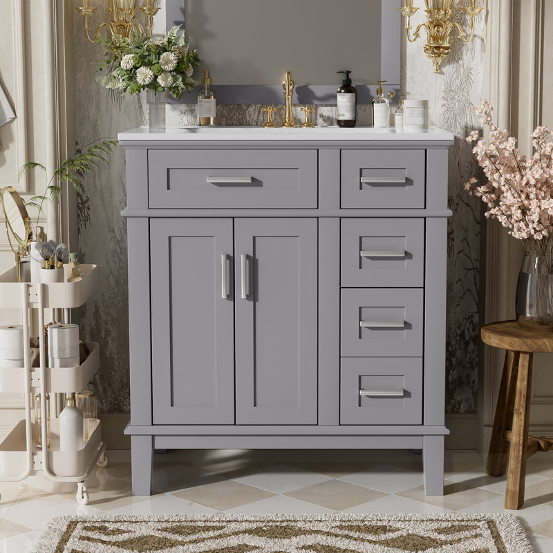 Meuble-lavabo moderne avec lavabo en céramique, portes à fermeture en douceur et tiroirs spacieux pour les petites salles de bain