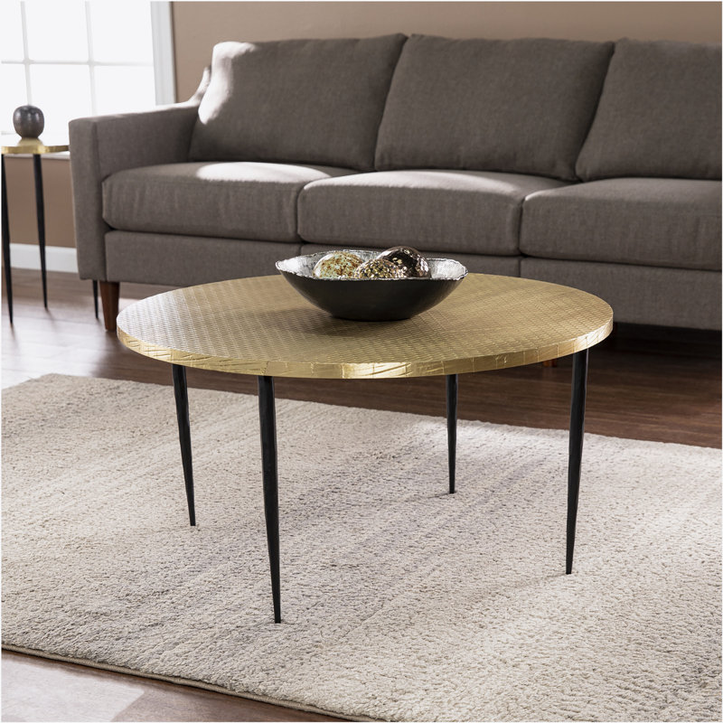 Table basse ronde avec plateau en relief