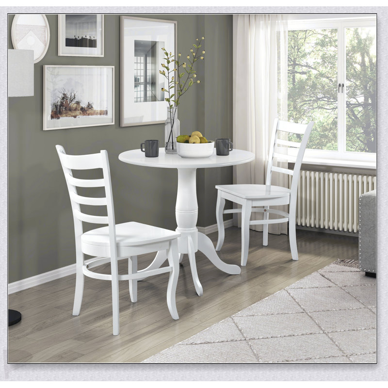 Table ronde à finition blanche avec base en piédestal en bois, parfaite pour les repas de style campagnard décontracté et les petits espaces