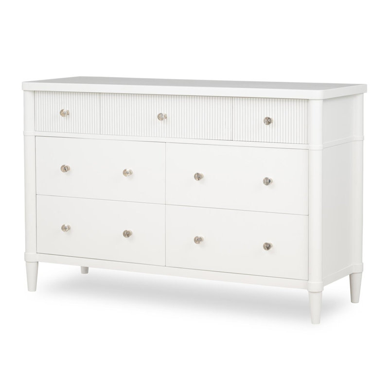 Commode à 7 tiroirs Lippert, façades de tiroirs cannelées de 132 cm de large, poignées à boule en acrylique