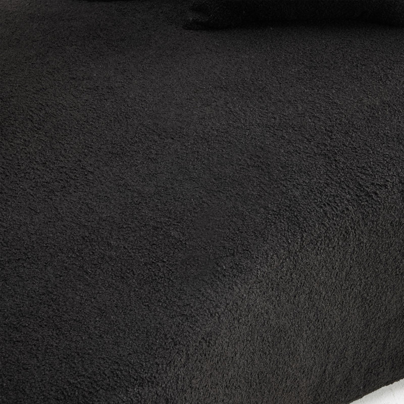 Causeuse compacte en velours noir, moderne pour les petits espaces