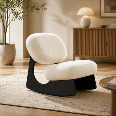 Fauteuil à bascule sans accoudoirs, à base creuse incurvée et revêtu de chenille douce au toucher, style sculptural moderne, idéal pour le salon, la chambre ou la chambre d'enfant.