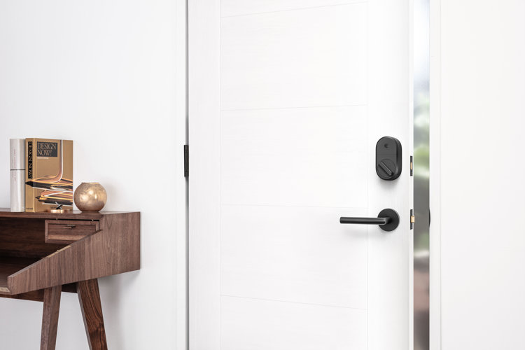 white exterior door with a door lever and a deadbolt