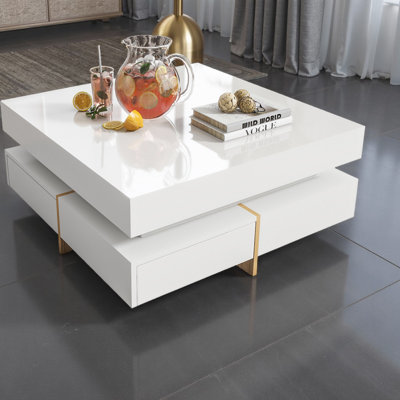 Table basse 31,5 "à haute brillance avec 4 tiroirs et pieds d'aspect bois