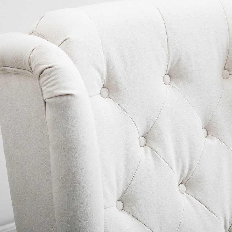 Chaise d'appoint avec capitonnage à boutons. Couleur blanc crème. Siège rembourré confortable et épais. Convient à plusieurs pièces. Fabrication en bois massif et en eucalyptus. 28,81 po de profondeur. 34,19 de largeur. 39,24 po de hauteur. Produit 40,02 lb