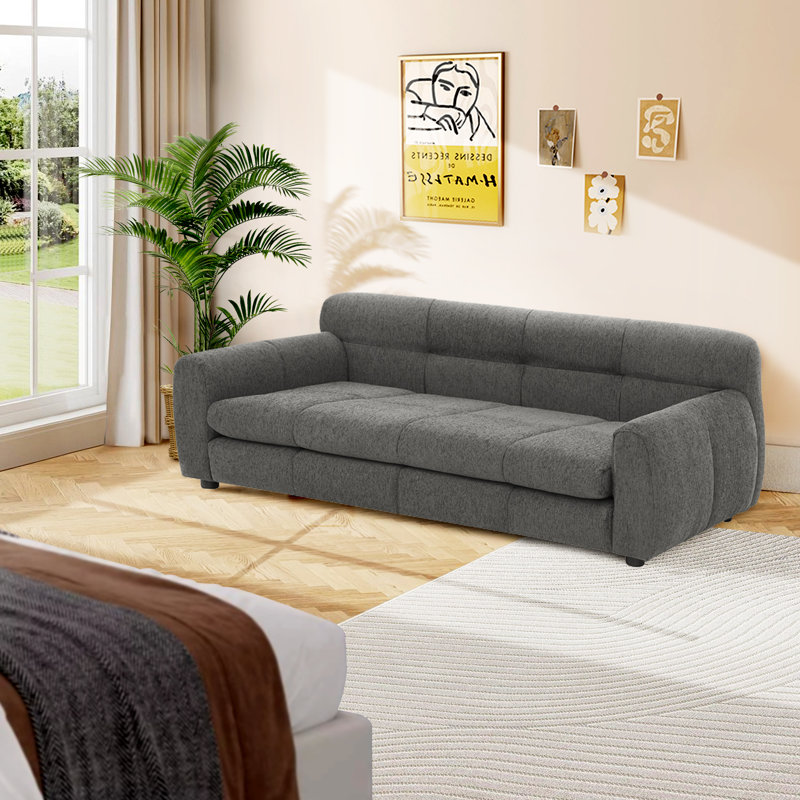 Canapé doux et confortable pour animaux de compagnie avec dossier et accoudoirs, avec un design rectangulaire moderne convenant aux chiens de grande taille.