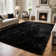 Soft black shag area rug
