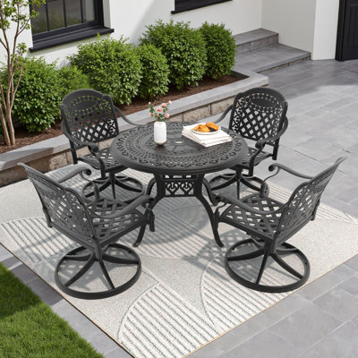 Ensemble de patio moderne en fonte d'aluminium noir avec chaises pivotantes coussinées et table ronde pour balcon ou jardin