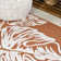Delmoe High-Low Two-Tone Monstera Leaf Orange/Ivory Indoor/Outdoor Rug