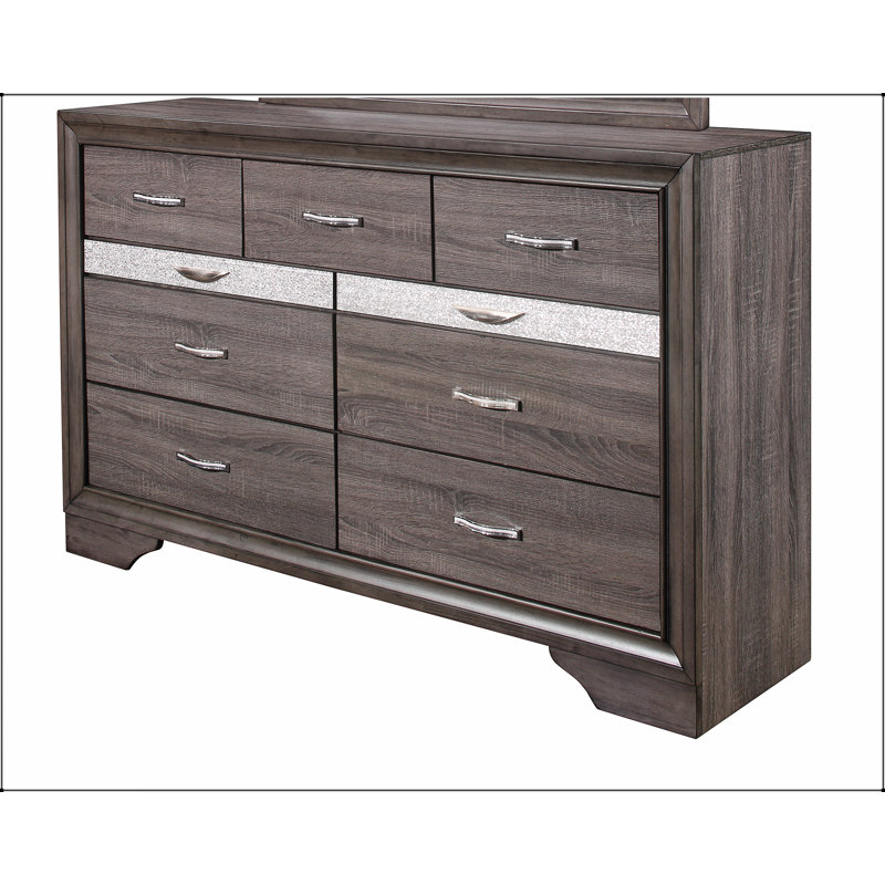 La commode Ryder Sparkle Grey avec neuf tiroirs spacieux et un compartiment à bijoux aux lignes douces est parfaite pour les chambres à coucher modernes.