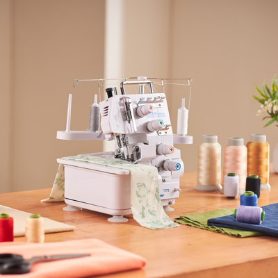 Machine à coudre surjeteuse Serger, 1250 points par minute, capacité de 3 et 4 fils, avec lumière DEL et pieds d'aspiration robustes, machine à coudre à cadre métallique robuste pour divers tissus, blanc
