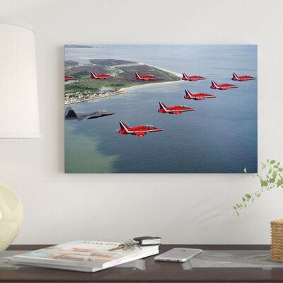 A F-22 Raptor Flies in Formation with the Royal Air Force Aerobatic Team the Red Arrows' Photographic Print on Canvas -  East Urban Home, 70DBAB51441249F2B117102A4E443670